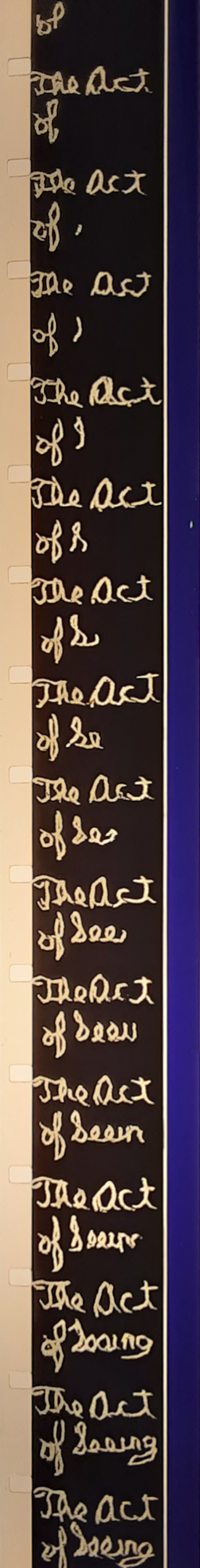 A color photograph of a strip of 16mm film. The frames show the handwritten title card for Stan Brakhage's The Act of Seeing with One's Own Eyes